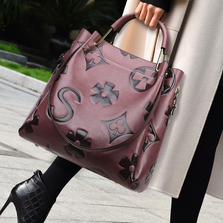 Lucia | Borsa a secchiello vintage testurizzata con pochette removibile