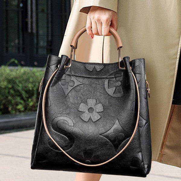 Lucia | Borsa a secchiello vintage testurizzata con pochette removibile