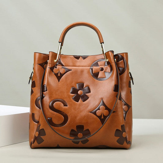 Lucia | Borsa a secchiello vintage testurizzata con pochette removibile